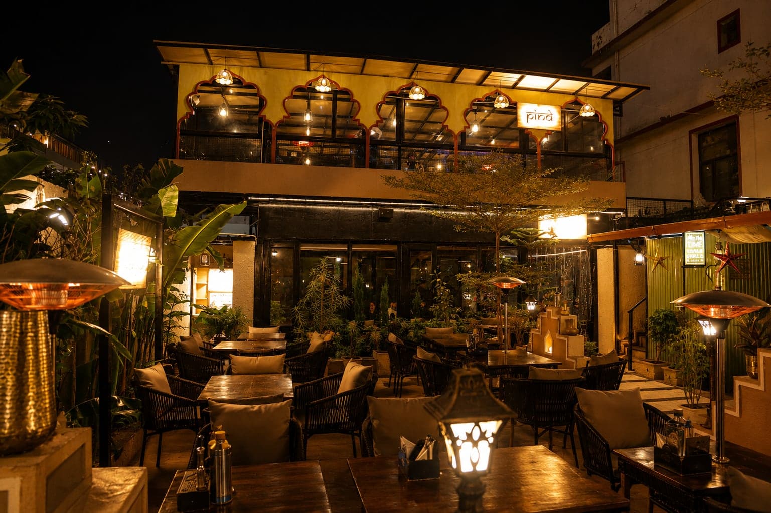 The covered terrace framed in greenery